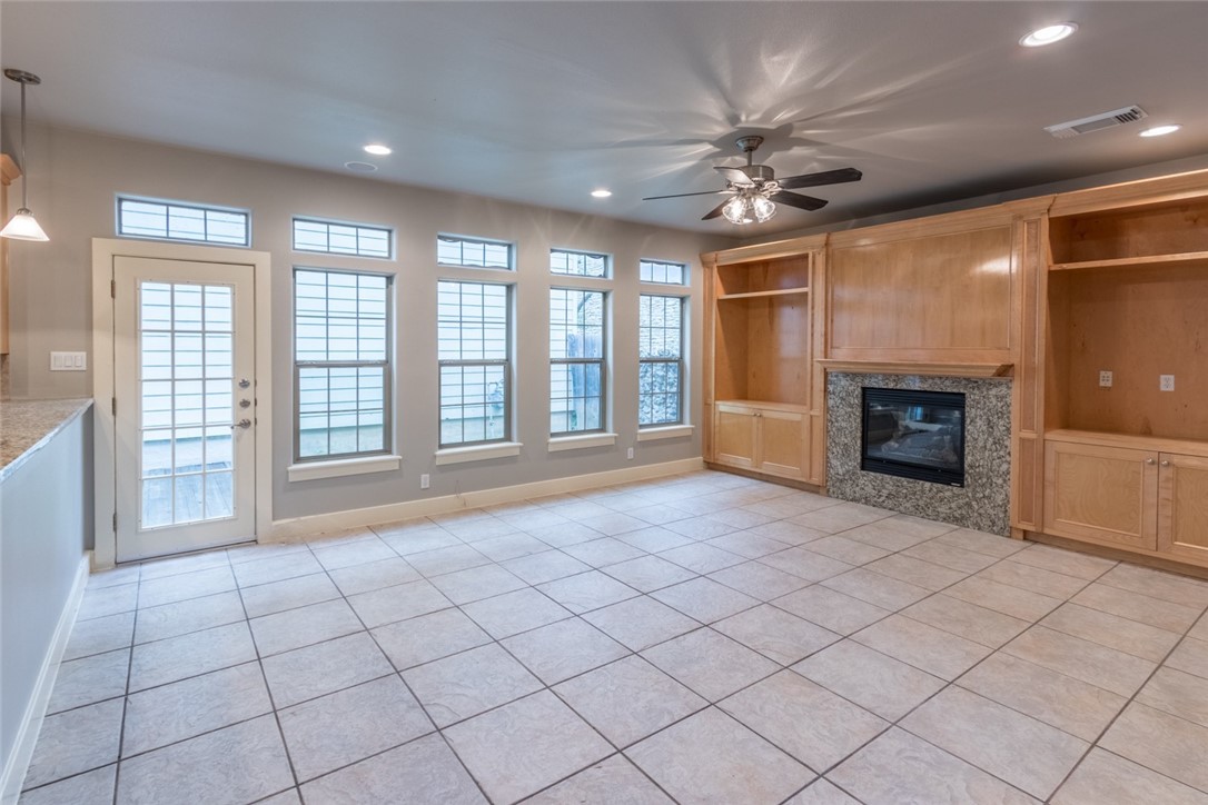 306 East 34th Street, Unit A Austin, TX 78705 - Photo 2 of 25 a view of an empty room with a fireplace and a window