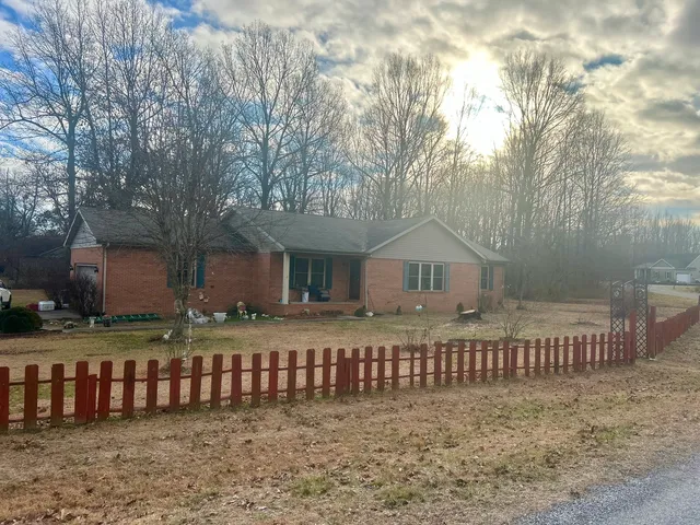 a front view of a house with a fence