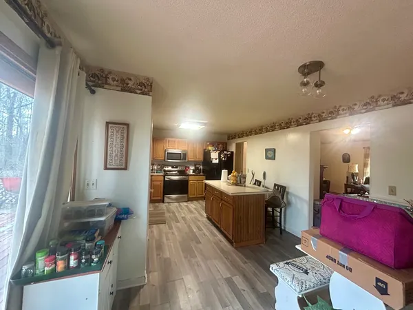 a bedroom with a bed and lamp with window