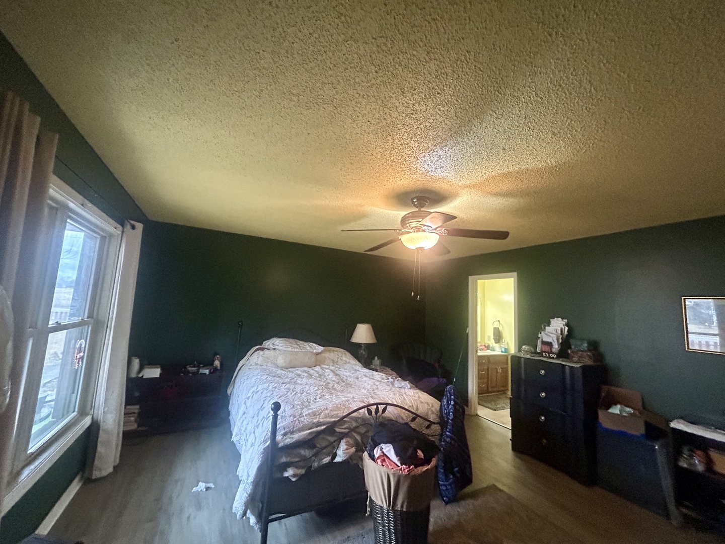 6 Carriage Lane Metropolis, IL 62960 - Photo 27 of 35 a bedroom with a bed and a chandelier