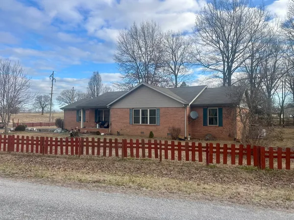 a front view of a house with a fence