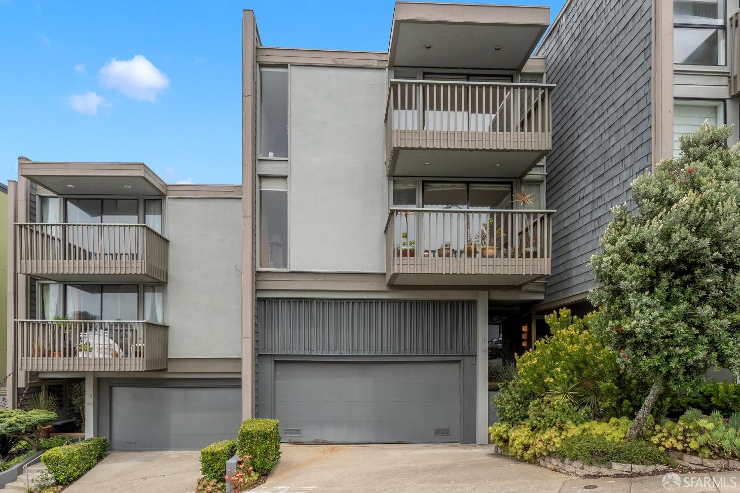 a view of small house with roof deck