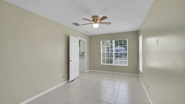 a view of an empty room with a window