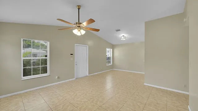 a view of an empty room with a window