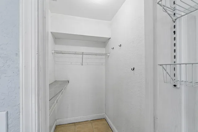 a bathroom with a shower sink vanity and mirror