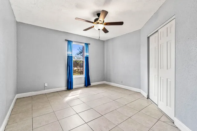 a bathroom with a sink vanity and toilet