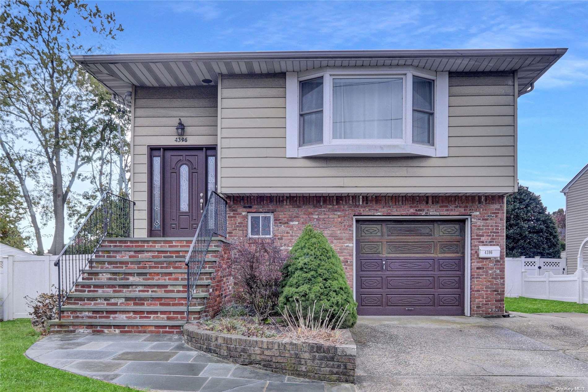 4396 Merrick Road Massapequa, NY 11758 - Photo 1 of 1 a front view of a house