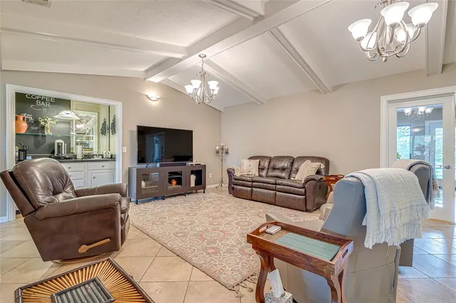 a bathroom with a granite countertop sink a large mirror and a window