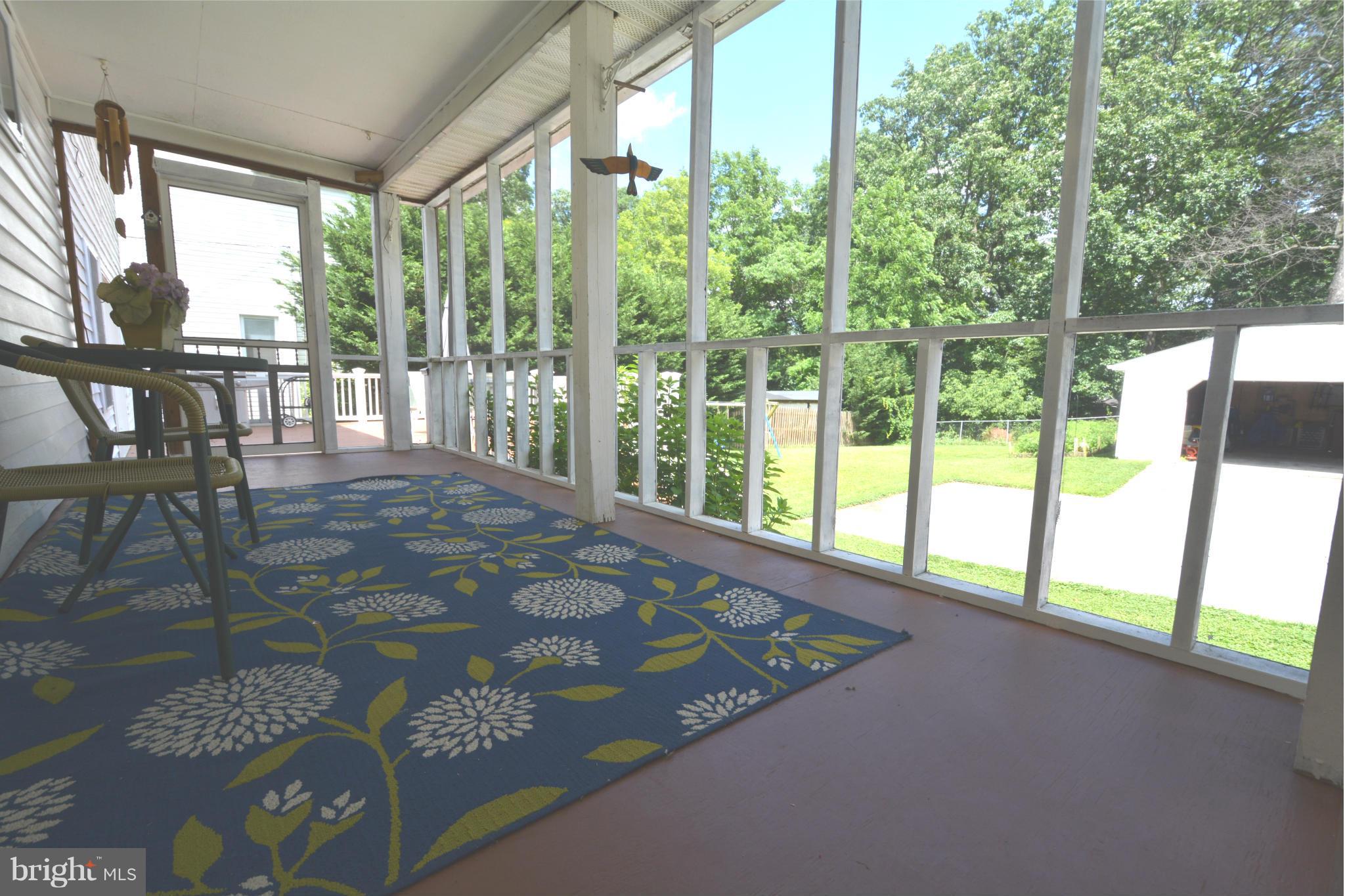 5911 Medora Road Linthicum, MD 21090 - Photo 4 of 30 a view of a floor to ceiling window and wooden floor