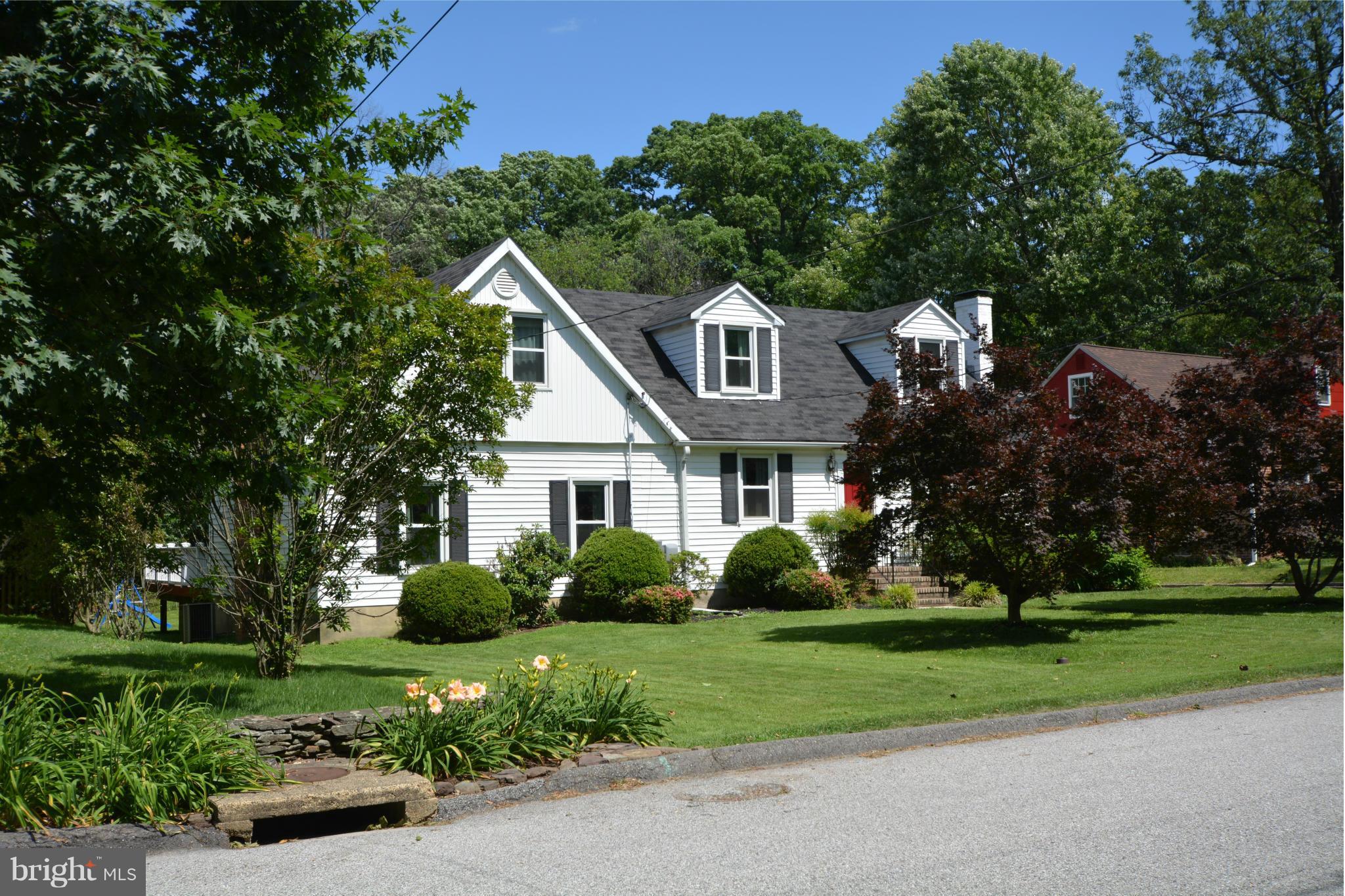 5911 Medora Road Linthicum, MD 21090 - Photo 5 of 30 a front view of a house with a yard and trees