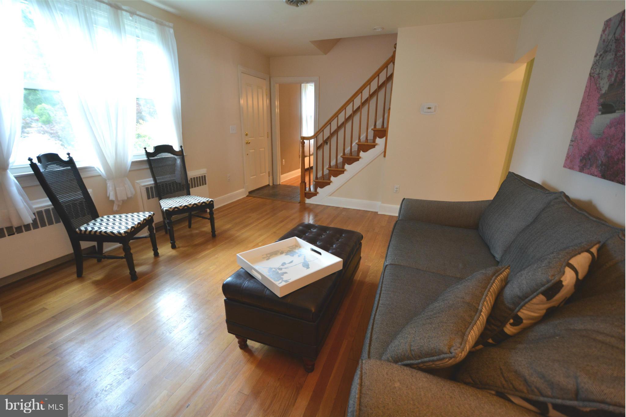 5911 Medora Road Linthicum, MD 21090 - Photo 7 of 30 a living room with furniture and a wooden floor