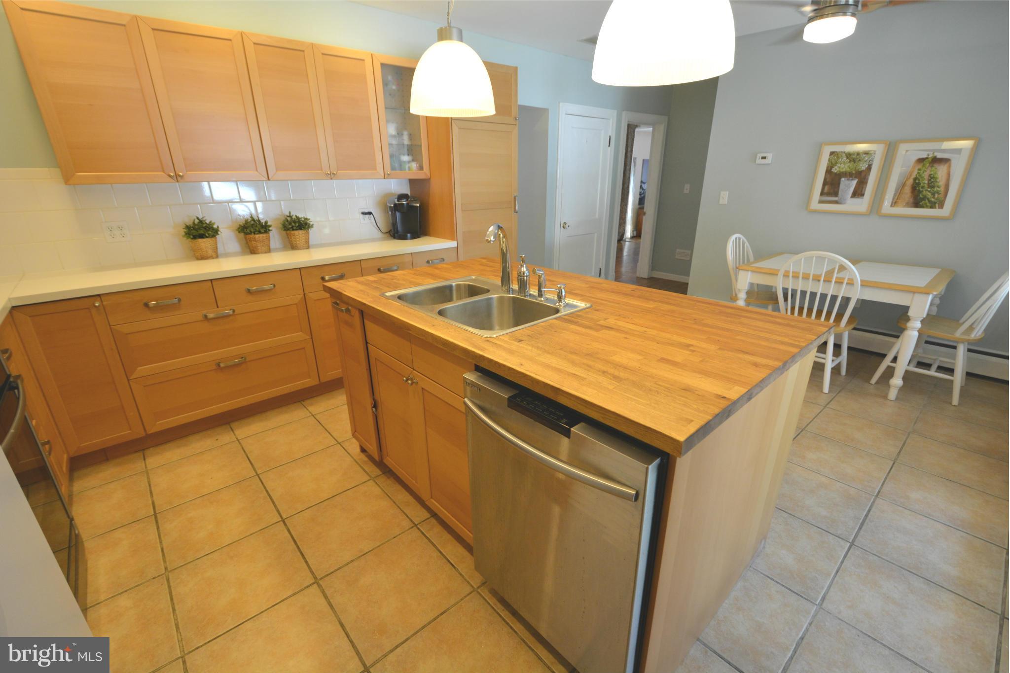 5911 Medora Road Linthicum, MD 21090 - Photo 8 of 30 a kitchen with a sink cabinets and window
