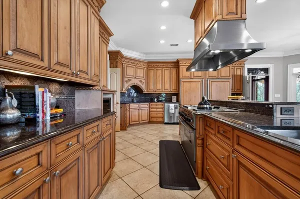 a living room with couches and wooden floor