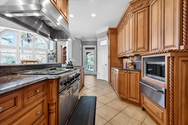 a view of a balcony with wooden floor and outdoor space