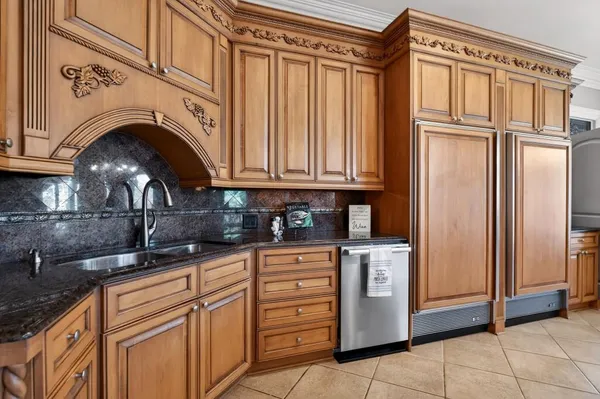 a spacious bedroom with a large bed and a fireplace