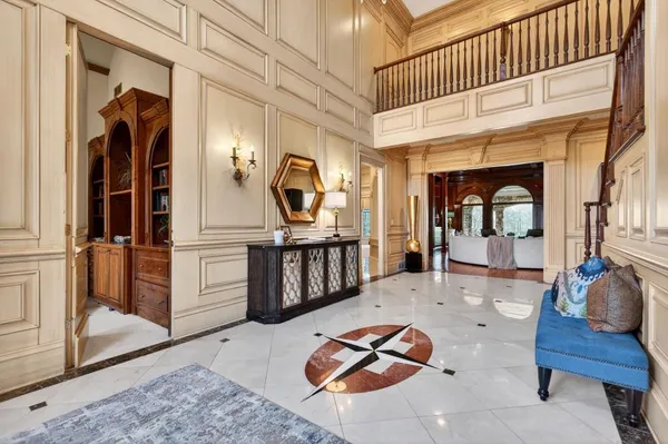 a spacious bathroom with a double vanity sink a mirror and a shower