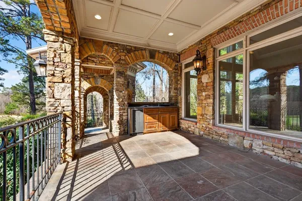 a bathroom with a granite countertop sink a toilet and shower