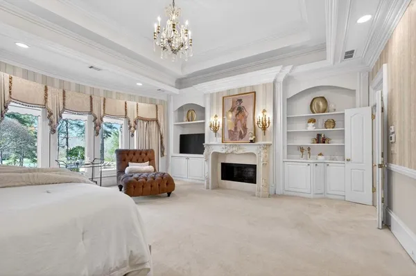 a bed room with a bed and a large window