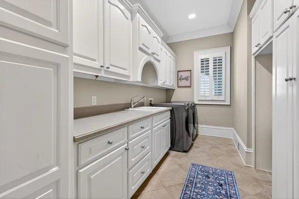 a view of a building with a table and chairs under an umbrella