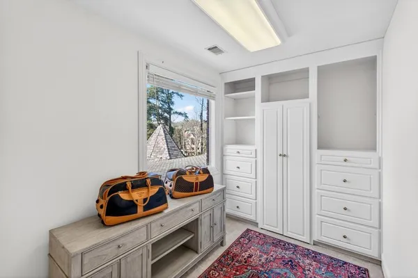 a front view of a house with swimming pool and sitting area