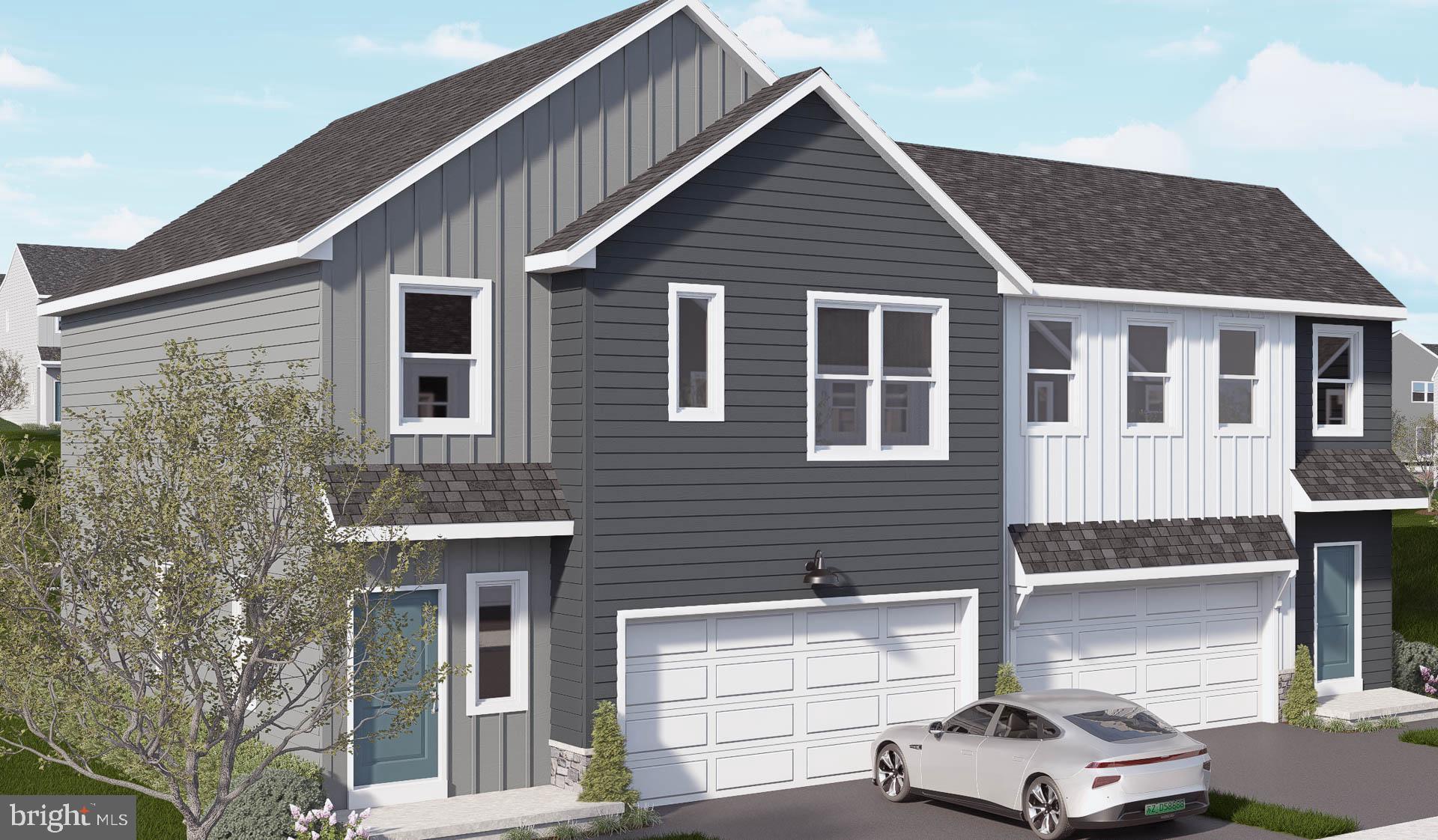 a front view of a house with a garage