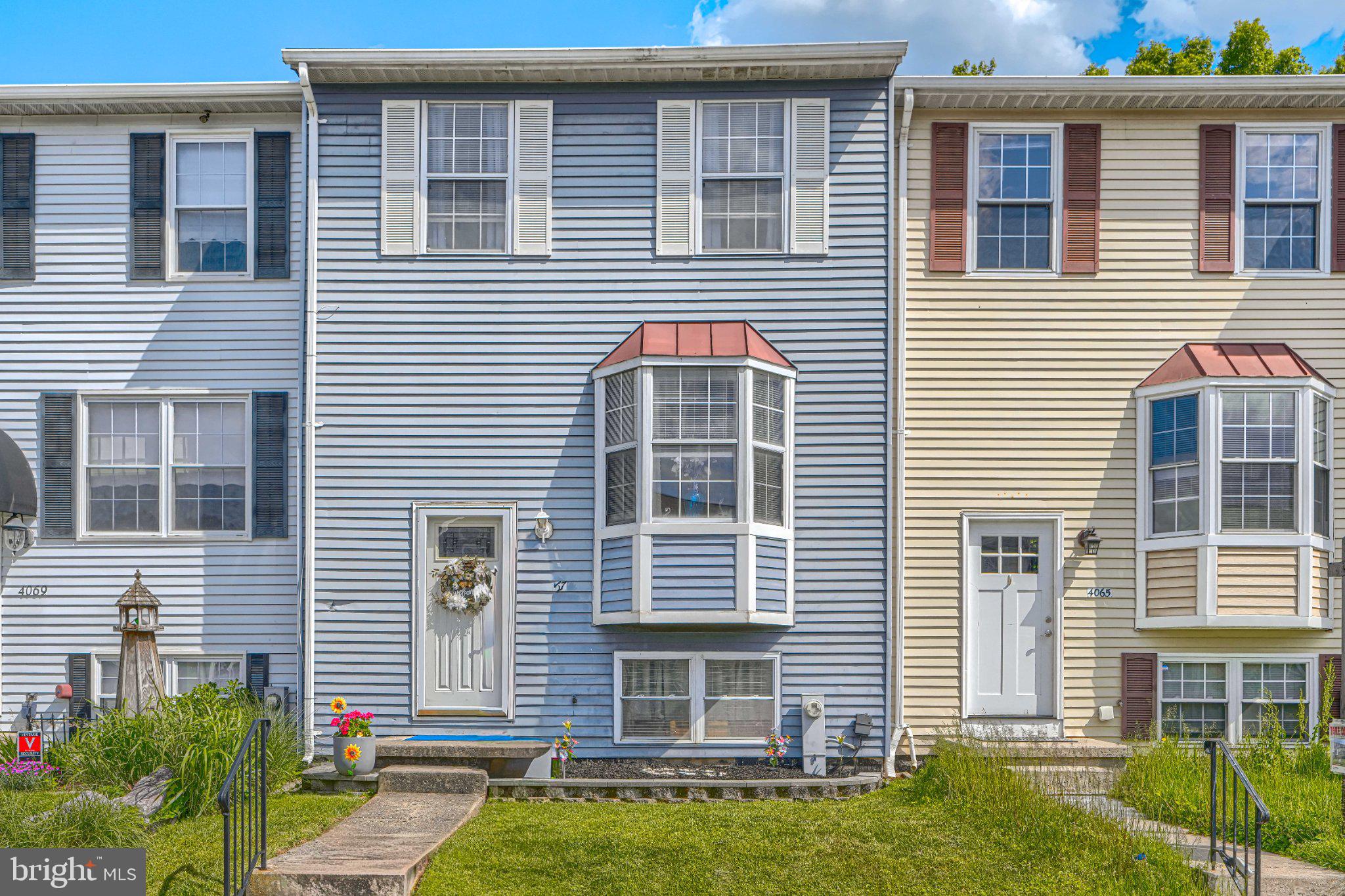 4067 Rustico Road Baltimore, MD 21220 - Photo 1 of 31 Charming townhouse with inviting curb appeal.