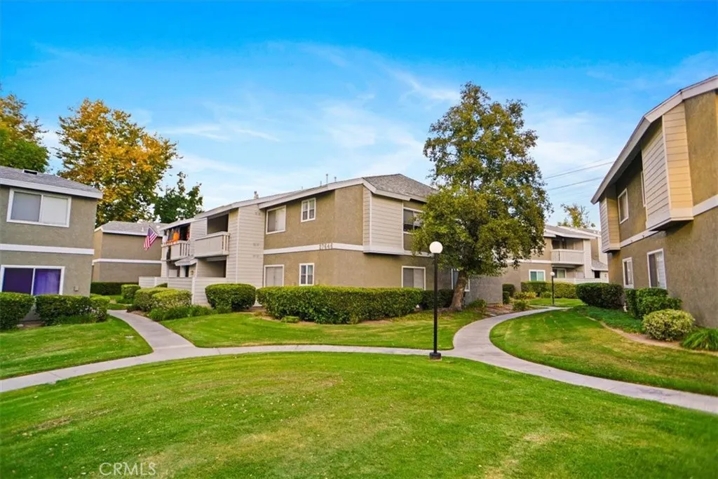 27646 Susan Beth Way Saugus, CA 91350 - Photo 1 of 12 a view of a white house in a big yard with potted plants and large trees