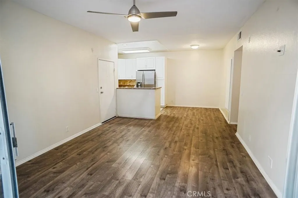 27646 Susan Beth Way Saugus, CA 91350 - Photo 5 of 12 a view of empty room with wooden floor