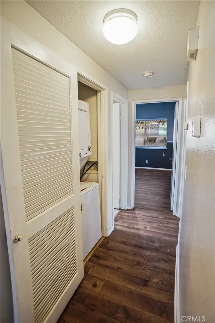 27646 Susan Beth Way Saugus, CA 91350 - Photo 6 of 12 a view of a hallway with wooden floor and a bathroom