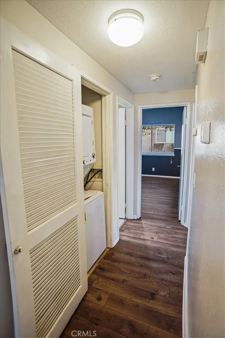27646 Susan Beth Way Saugus, CA 91350 - Photo 6 of 12 a view of a hallway with wooden floor and a bathroom