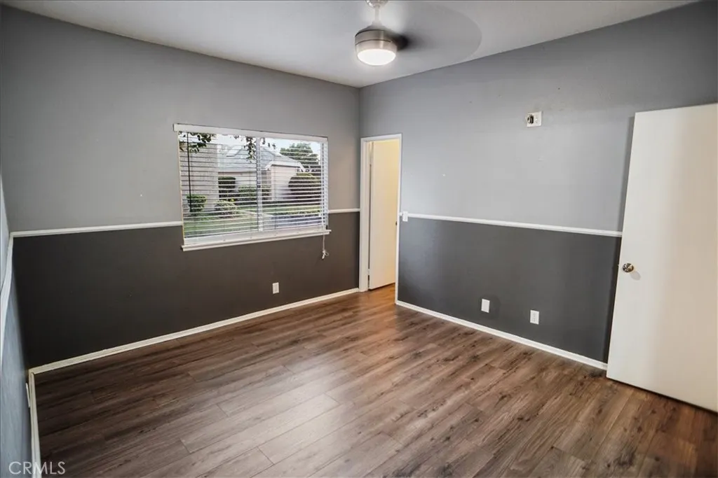 27646 Susan Beth Way Saugus, CA 91350 - Photo 7 of 12 a view of an empty room with wooden floor and a window