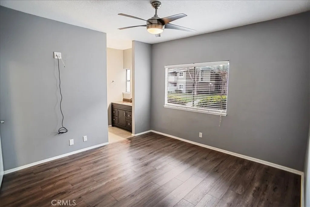 27646 Susan Beth Way Saugus, CA 91350 - Photo 9 of 12 a view of an empty room with a window and wooden floor