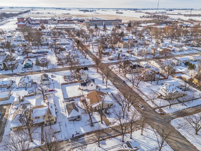 an aerial view of a house with a yard