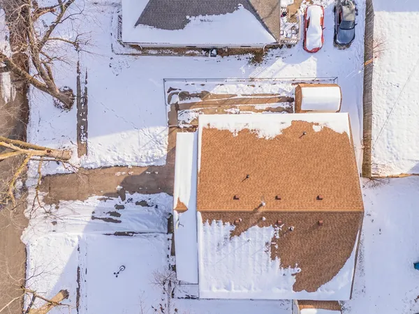 a view of a house with backyard of snow