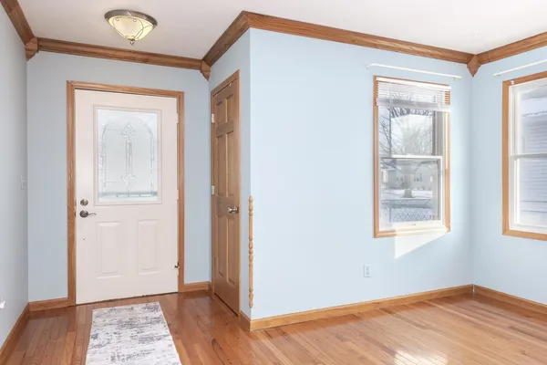 a view of a kitchen with a sink a refrigerator and window