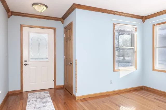 a view of a kitchen with a sink a refrigerator and window