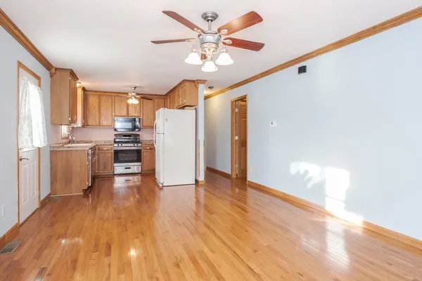 a kitchen with a stove a sink and a refrigerator