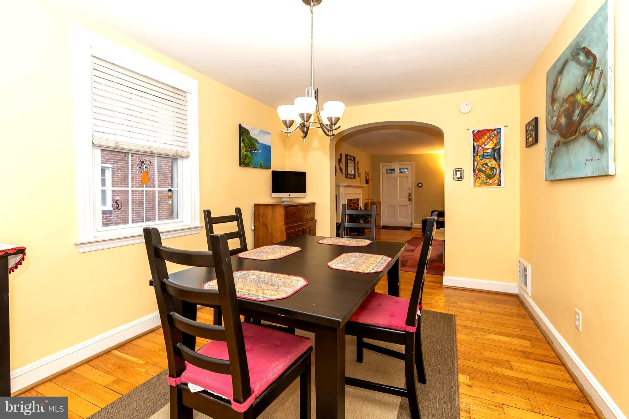 52 Woodbine Road Havertown, PA 19083 - Photo 13 of 38 a view of a dining room with furniture and a chandelier