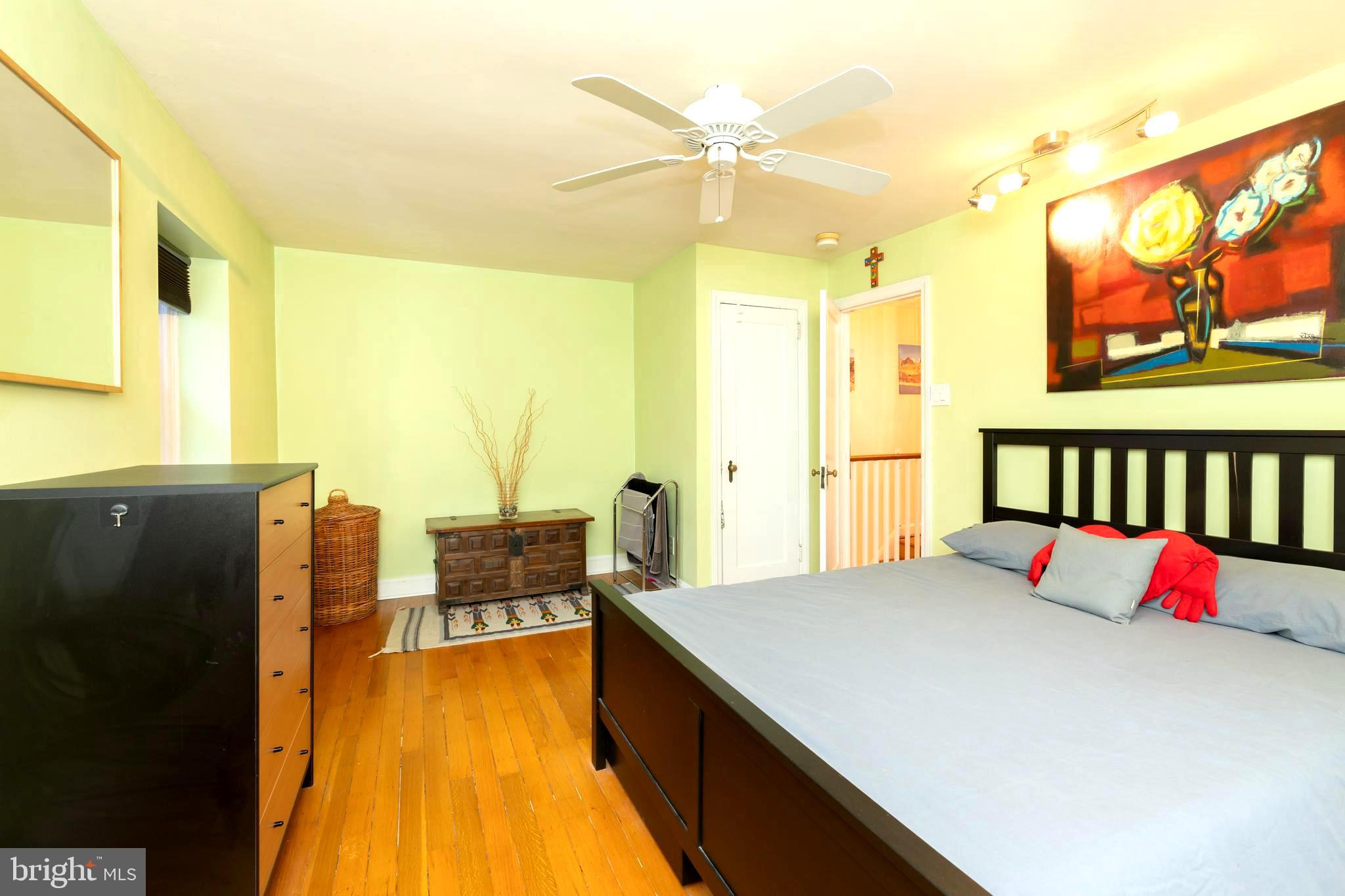 52 Woodbine Road Havertown, PA 19083 - Photo 19 of 38 a bedroom with a bed and wooden floor