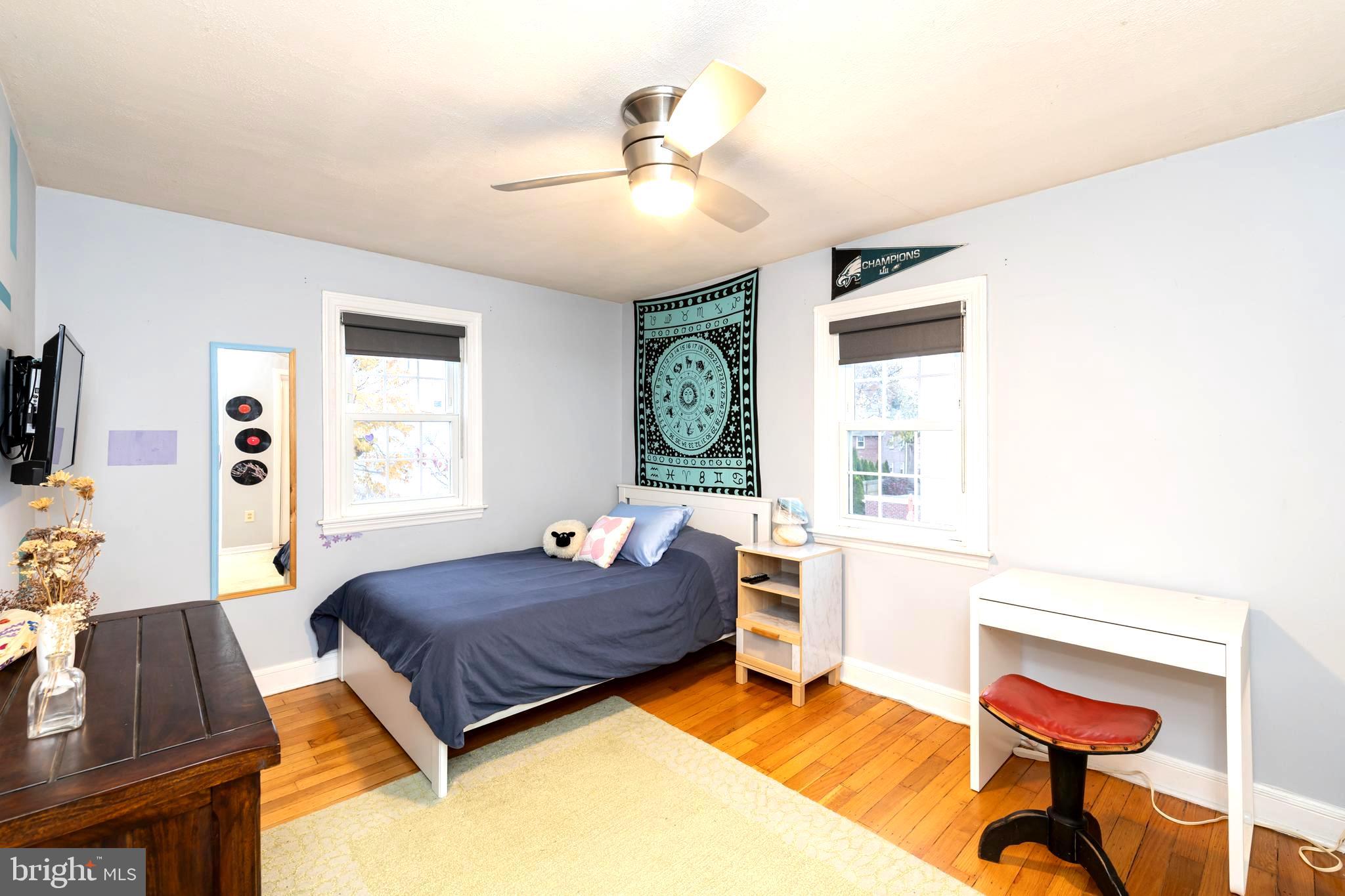 52 Woodbine Road Havertown, PA 19083 - Photo 21 of 38 a living room with a bed furniture and a window