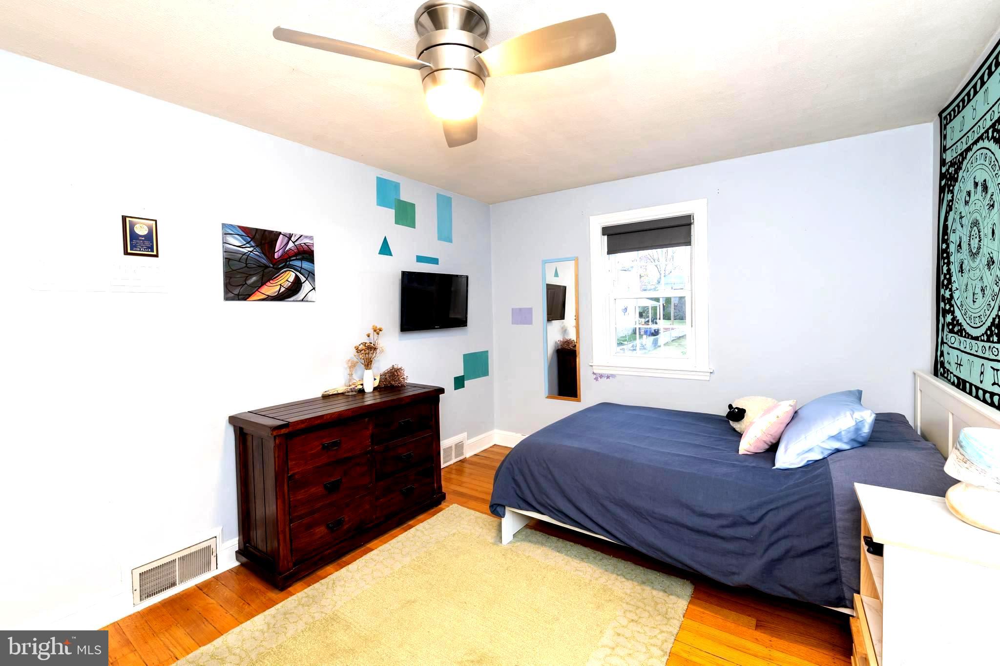 52 Woodbine Road Havertown, PA 19083 - Photo 22 of 38 a bedroom with a bed window and a flat screen tv