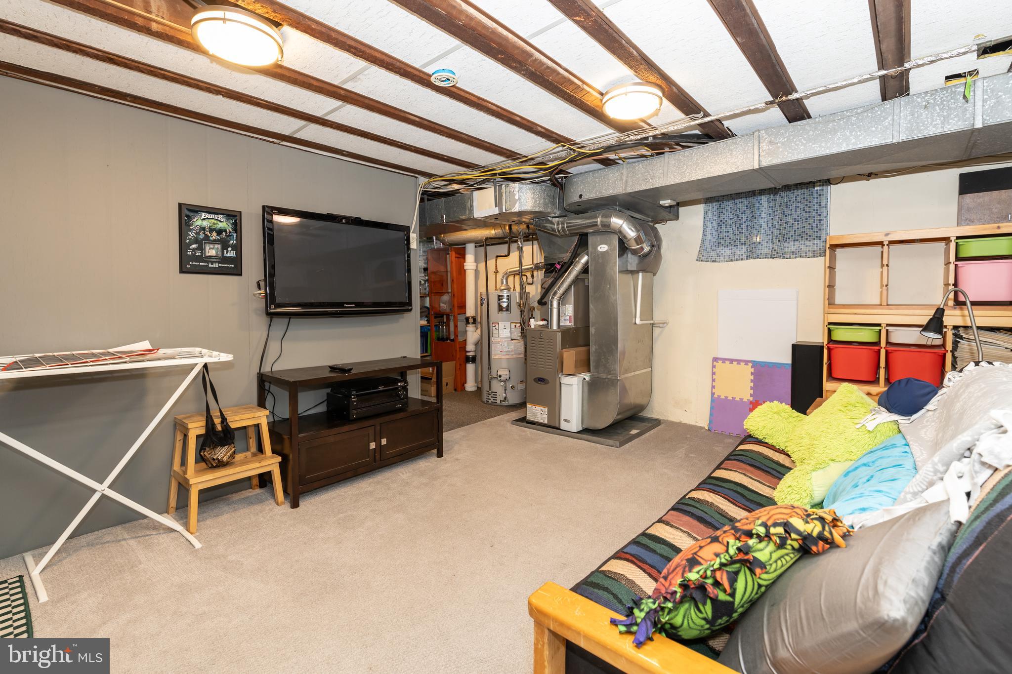 52 Woodbine Road Havertown, PA 19083 - Photo 30 of 38 a living room with furniture and a flat screen tv