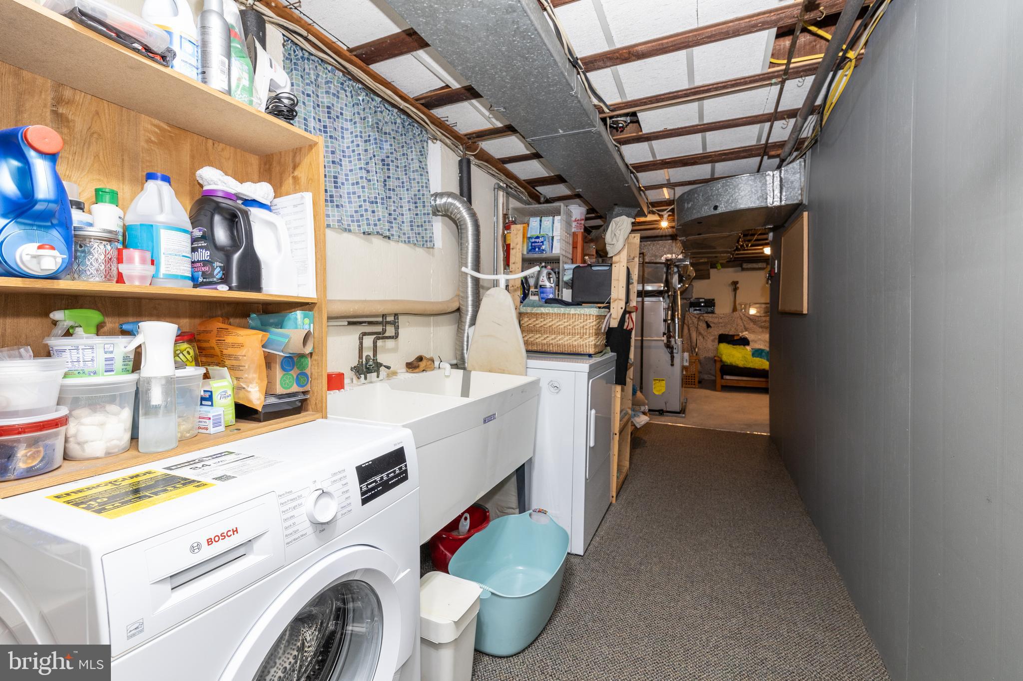 52 Woodbine Road Havertown, PA 19083 - Photo 33 of 38 a storage room with washer and dryer