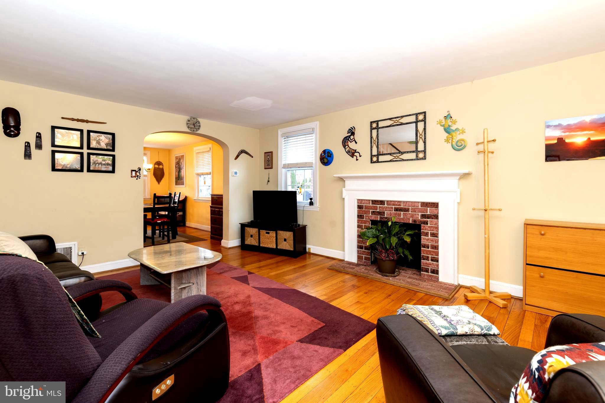 52 Woodbine Road Havertown, PA 19083 - Photo 8 of 38 a living room with furniture and a fireplace