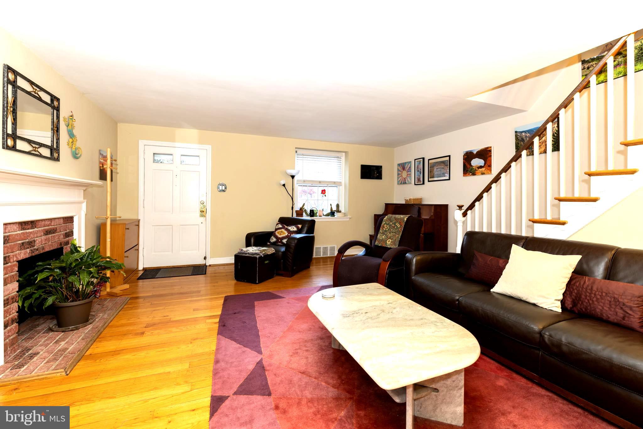 52 Woodbine Road Havertown, PA 19083 - Photo 9 of 38 a living room with furniture and a fireplace