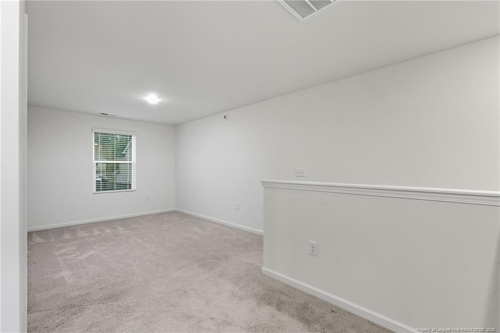 28 White Hart Court Angier, NC 27501 - Photo 18 of 36 a view of an empty room with a window