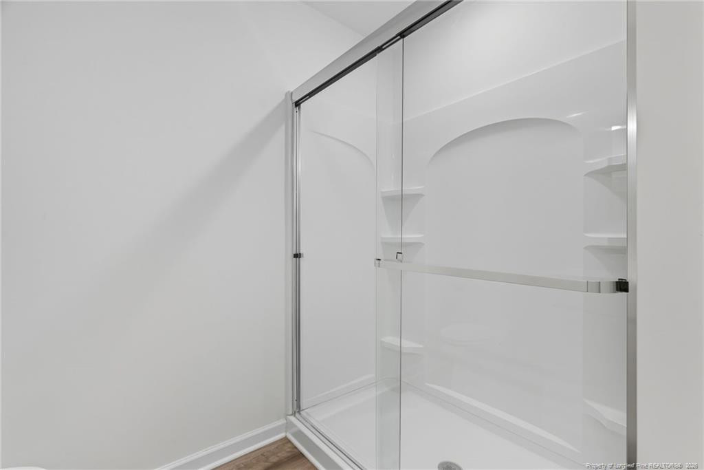28 White Hart Court Angier, NC 27501 - Photo 22 of 36 a bathroom with a shower