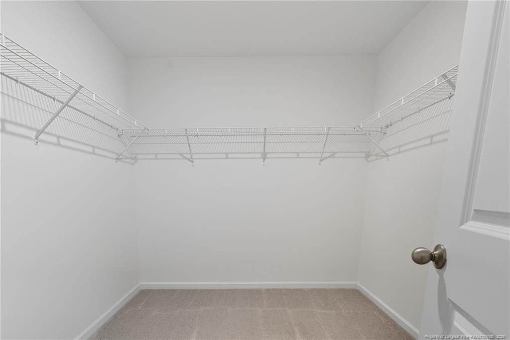 28 White Hart Court Angier, NC 27501 - Photo 24 of 36 a view of a room with racks on the wall