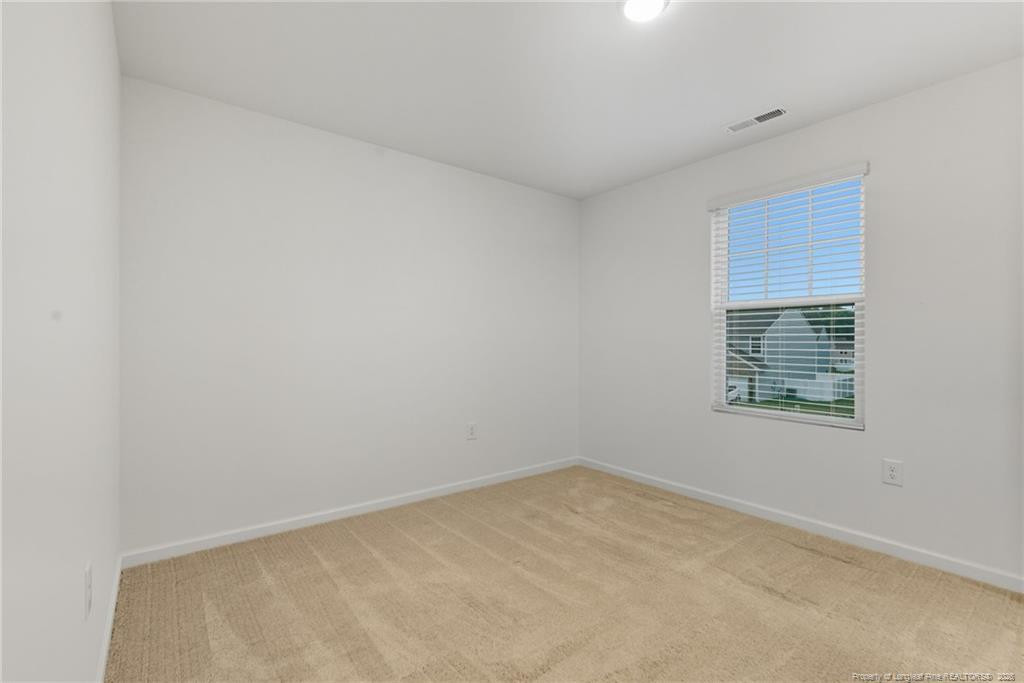 28 White Hart Court Angier, NC 27501 - Photo 25 of 36 a view of an empty room with a window