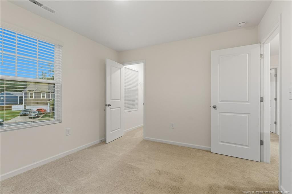 28 White Hart Court Angier, NC 27501 - Photo 26 of 36 a view of an empty room with a window